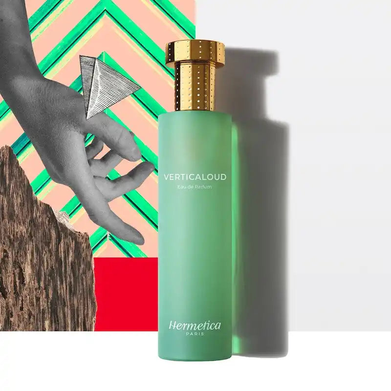 Mint green perfume bottle with a gold cap.